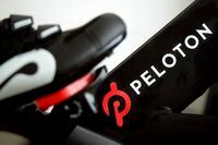 This Nov. 19, 2019 file photo shows the logo on a Peloton bike in San Francisco.
