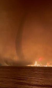 A fire tornado, or fire whirl, is seen in a video shot by the BC Wildfire Service at Gun Lake in the B.C. Interior overnight on August 17, 2023. THE CANADIAN PRESS/HO - BC Wildfire Service