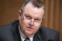 Sen. Jon Tester, D-Mont., questions Treasury Secretary Janet Yellen as she testifies before the Senate Banking, Housing, and Urban Affairs Committee hearing, Tuesday, May 10, 2022, on Capitol Hill in Washington. Tester is among the U.S. lawmakers urging the Biden administration to follow Canada’s lead in easing COVID-19 travel restrictions at the northern border. THE CANADIAN PRESS/AP-Tom Williams/Pool via AP
