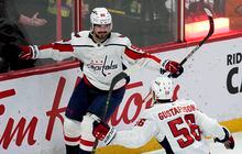 Washington Capitals left wing Marcus Johansson celebrates his game-winning overtime goal with defenceman Erik Gustafsson during overtime NHL action against the Ottawa Senators, Thursday, December 22, 2022 in Ottawa.  THE CANADIAN PRESS/Adrian Wyld