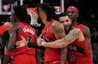 Toronto Raptors guard Fred VanVleet (23) hugs guard Gary Trent Jr. (33) during second half NBA basketball action against the Indiana Pacers in Toronto on Wednesday, October 27, 2021. THE CANADIAN PRESS/Nathan Denette