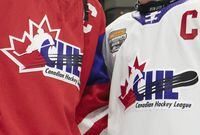 Team Red and Team White logos are shown following the CHL Top Prospects Game in Hamilton, Ont. on January 16, 2020. The Canadian Hockey League has settled three class-action lawsuits filed by former and current junior players seeking backpay for minimum wage. The CHL -- an umbrella organization for the Western Hockey League, Ontario Hockey League and Quebec Major Junior Hockey League -- and the plaintiffs announced the settlements that amount to a total of $30 million on Friday. HE CANADIAN PRESS/Peter Power