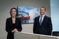 David and Natasha Sharpe, of Bridging Finance Inc. are photographed in the company's downtown Toronto offices on April 11 2019. Bridging Finance provided financing for the purchase of the MV Sivulliq (in the painting behind the couple) a shrimp trawler.