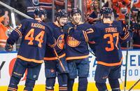 Edmonton Oilers' Zack Kassian (44), Ryan McLeod (71), Evan Bouchard (75) and Warren Foegele (37) celebrate a goal against Los Angeles Kings during second period NHL playoff action in Edmonton on Wednesday, May 4, 2022.THE CANADIAN PRESS/Jason Franson 