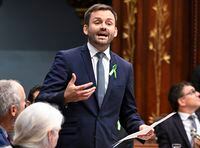 Parti Québécois Leader Paul St-Pierre Plamondon praises his newly sworn in member, Pascal Paradis, prior to question period, Tuesday, October 17, 2023 at the legislature in Quebec City. THE CANADIAN PRESS/Jacques Boissinot