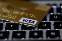 FILE PHOTO: A Visa credit card is seen on a computer keyboard in this picture illustration taken September 6, 2017. REUTERS/Philippe Wojazer/Illustration/File Photo/File Photo