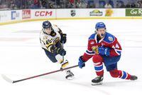 Edmonton Oil Kings' Carter Souch, right, reacts after deflecting a shot by Shawinigan Cataractes' Jordan Tourigny during the second period of Memorial Cup hockey action in Saint John, N.B. on Tuesday, June 21, 2022. THE CANADIAN PRESS/Darren Calabrese