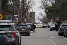 Police cars park at the scene of a shooting at a high school in Toronto on February 16, 2023. Police say one person was shot at Weston Collegiate Institute during the lunch break on Thursday. THE CANADIAN PRESS/Arlyn McAdorey