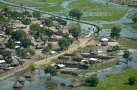 Thatched huts surrounded by floodwaters are seen from the air in Old Fangak county, Jonglei state, South Sudan Friday, Nov. 27, 2020. Some 1 million people in the country have been displaced or isolated for months by the worst flooding in memory, with the intense rainy season a sign of climate change. (AP Photo/Maura Ajak)