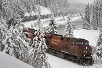 A Canadian Pacific train hauls oil westward through Banff National Park in Alberta, Canada on Sunday, November 28, 2021. THE CANADIAN PRESS/Frank Gunn