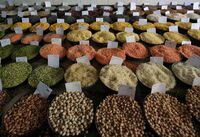 FILE PHOTO: Price tags are seen on the samples of rice and lentils that are kept on display for sale at a wholesale market in the old quarters of Delhi, India, June 7, 2018. REUTERS/Amit Dave/File Photo