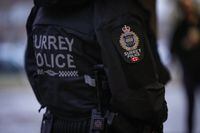 A Surrey police department logo is seen on an officer's jacket in Surrey, B.C., Monday, Oct. 31, 2022. The union representing members of the fledgling Surrey Police Service says its officers and civilian workers have "no intention" of joining the RCMP, should the municipal force be scrapped. THE CANADIAN PRESS/Darryl Dyck