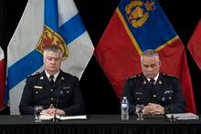 Interim RCMP Commissioner Mike Duheme, right, and Assistant Commissioner Dennis Daley, commanding officer of the Nova Scotia RCMP, prepare to speak to reporters following the Mass Casualty Commission inquiry's final report into the mass murders in rural Nova Scotia in Truro, N.S. on Thursday, March 30, 2023. THE CANADIAN PRESS/Darren Calabrese