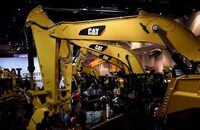FILE PHOTO: A row of excavators are seen at the Caterpillar booth at the CONEXPO-CON/AGG convention at the Las Vegas Convention Center in Las Vegas, Nevada, U.S. March 9, 2017. REUTERS/David Becker
