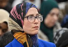Amira Elghawaby looks on during a ceremony marking the sixth anniversary of the fatal mosque shooting, Sunday, January 29, 2023  at the mosque in Quebec City. Elghawaby was nominated by the federal government as special representative on combating islamophobia. THE CANADIAN PRESS/Jacques Boissinot