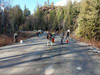Tahsis Mayor Martin Davis and a group of community volunteers fill in the pothole-ridden Head Bay Forest Service Road, that is their only land route in and out of the community on the west coast of Vancouver Island. Credit: Jack Taylor 