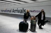 Travellers arrive at Heathrow Airport in London, Sunday, Jan. 17, 2021. Fully vaccinated Canadian travellers have been left out of plans to ease quarantine restrictions for entry in the United Kingdom. THE CANADIAN PRESS/AP-Frank Augstein