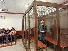 Russian opposition figure Vladimir Kara-Murza, accused of treason and of discrediting the Russian army, stands inside an enclosure for defendants during a court hearing in Moscow, Russia, April 17, 2023. Moscow City Court/Handout via REUTERS