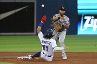 Chicago White Sox’s Leury Garcia, right, forces out Toronto Blue Jays’ Bo Bichette (11) and throws to first to complete a double play putting out Marcus Semien in the sixth inning of an American League baseball game in Toronto on Tuesday, Aug. 24, 2021. THE CANADIAN PRESS/Jon Blacker