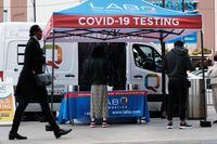 NEW YORK, NEW YORK - APRIL 18: A Covid-19 testing site stands on a Brooklyn street corner on April 18, 2022 in New York City. New York City's infection numbers have increased over the past 45 days with a positivity rate of nearly 4.5% and a rate significantly higher in some neighborhoods. Two omicron sub-variants of the highly transmissible BA.2 strain are fueling the current surge.  (Photo by Spencer Platt/Getty Images)