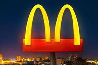 Image of a McDonald's ad that was criticized for separating the arches to promote social distancing that was found to be insensitive. 
