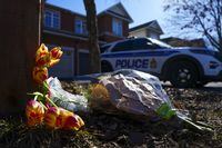 Flowers sit at the scene of a homicide where six people were found dead in the Barrhaven suburb of Ottawa on Thursday, March 7, 2024. THE CANADIAN PRESS/Sean Kilpatrick