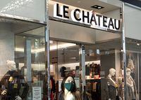 A woman in a face mask leaves a Le Chateau store at the Guildford Town Centre in Surrey, B.C., Friday, Dec. 4, 2020. Canadian retailer Le Chateau is making its brick-and-mortar store comeback.THE CANADIAN PRESS/Marissa Tiel