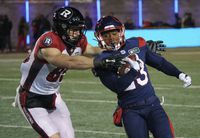 Montreal Alouettes running back Martese Jackson tries to get past Ottawa Redblacks fullback Marco Dubois on a kick return during first quarter CFL football action in Montreal on Friday, November 19, 2021. THE CANADIAN PRESS/Paul Chiasson
