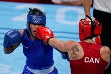 Boxing Canada announced Tuesday it is joining a boycott of the upcoming women's world championships due to the participation of Russian and Belarusian athletes. Canada's Myriam da Silva, right, lands a punch on Maria Altagracia Moronta Hernandez, of the Dominican Republic, during their women's welterweight 69-kg boxing match at the 2020 Summer Olympics, Tuesday, July 27, 2021, in Tokyo, Japan. THE CANADIAN PRESS-AP-Frank Franklin II