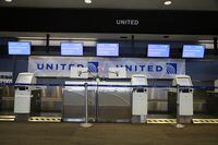 An empty United Airlines check-in counter at San Francisco International Airport, on Friday, May 22, 2020.