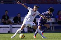 Canada forward Christine Sinclair (12) and Japan forward Mana Iwabuchi (10) vie for control of the ball during the first half in a SheBelieves Cup soccer match Wednesday, Feb. 22, 2023, in Frisco, Texas. (AP Photo/LM Otero)