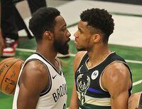MILWAUKEE, WISCONSIN - JUNE 17: Giannis Antetokounmpo #34 of the Milwaukee Bucks stares down Jeff Green #8 of the Brooklyn Nets after dunking on him at Fiserv Forum on June 17, 2021 in Milwaukee, Wisconsin. The Bucks defeated the Nets 104-89. NOTE TO USER: User expressly acknowledges and agrees that, by downloading and or using this photograph, User is consenting to the terms and conditions of the Getty Images License Agreement.  (Photo by Jonathan Daniel/Getty Images)