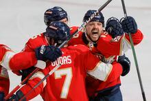 May 7, 2023; Sunrise, Florida, USA; Florida Panthers center Sam Reinhart (13) celebrates with defenseman Radko Gudas (7) and center Anton Lundell (15) after scoring the game-winning goal against the Toronto Maple Leafs during overtime in game three of the second round of the 2023 Stanley Cup Playoffs at FLA Live Arena. Mandatory Credit: Sam Navarro-USA TODAY Sports