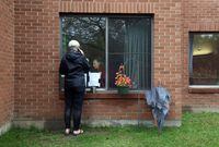 Susan Mills chats with her mother Barbara via a phone call at her nursing home August 29, 2020 in Arnprior, Ontario.  DAVE CHAN / THE GLOBE AND MAIL
