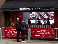 Pedestrians outside the Hudsons Bay Company flagship store which is closed due to COVID restrictions in Toronto on December 10, 2020.  /Aaron Vincent Elkaim/ The Globe and Mail