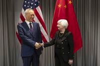 Treasury Secretary Janet Yellen, right, shakes hands with China's Vice-Premier Liu He during a bilateral meeting in Zurich, Switzerland on Wednesday, Jan. 18, 2023. (Michael Buholzer/Keystone via AP)