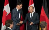 Prime Minister Justin Trudeau and German Chancellor Olaf Scholz shake hands at the start of a signing ceremony after signing a deal to kickstart a transatlantic hydrogen supply chain, on Tuesday, August 23, 2022 in Stephenville, Newfoundland and Labrador. The head of an advocacy group pushing to decarbonize Canada's public transit systems says the Canada-Germany hydrogen agreement sends a positive signal about the future of the industry. But Josipa Petrunic, president of the Canadian Urban Transit Research and Innovation Consortium, says if the experience with public transit in Canada is any indication, getting the projects off the ground may be more difficult than expected. THE CANADIAN PRESS/Adrian Wyld