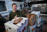 Chris Brown, Owner and Head Chef, Victor Dries Catering Company, is photographed on Jan 13 2021. Chris started Made With Love, a group that has delivered 35 000 meals to frontline organizations during the pandemic. The boxes of sweet potatoes was for one of the dishes this week.