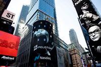 The Peloton logo is displayed, center, on the Nasdaq MarketSite, Thursday, Sept. 26, 2019 in New York's Times Square.