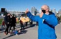 NDP Leader John Horgan greets supporters on election day in Vancouver, Saturday, October 24, 2020. THE CANADIAN PRESS/Jonathan Hayward