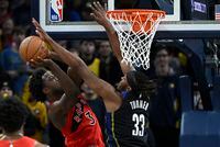 Toronto Raptors forward O.G. Anunoby (3) shoots against Indiana Pacers center Myles Turner (33) during the second half of an NBA basketball game, Saturday, Nov. 12, 2022, in Indianapolis, Ind. (AP Photo/Marc Lebryk)