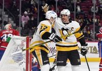 Nov 18, 2021; Montreal, Quebec, CAN; Pittsburgh Penguins forward Sidney Crosby (87) reacts with teammate forward Bryan Rust (17) after scoring a goal against the Montreal Canadiens during the first period at the Bell Centre. Mandatory Credit: Eric Bolte-USA TODAY Sports