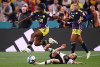 Colombia's forward #18 Linda Caicedo (L) is tackled by Germany's forward #09 Svenja Huth (R) during the Australia and New Zealand 2023 Women's World Cup Group H football match between Germany and Colombia at Sydney Football Stadium in Sydney on July 30.