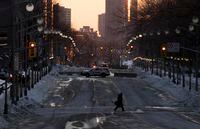 A person crosses Wellington St. inside the restricted area, Wednesday, Feb. 23, 2022 in Ottawa.  THE CANADIAN PRESS/Adrian Wyld