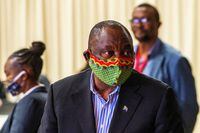 FILE PHOTO: FILE PHOTO: South African President Cyril Ramaphosa visits the coronavirus disease (COVID-19) treatment facilities at the NASREC Expo Centre in Johannesburg, South Africa April 24, 2020. Jerome Delay/Pool via REUTERS/File Photo