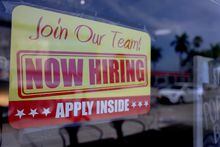 MIAMI, FLORIDA - MAY 05: A 'Now Hiring' sign posted in the window of a restaurant looking to hire workers on May 05, 2023 in Miami, Florida. A report by the Bureau of Labor Statistics showed the US economy added 253,000 jobs in April.  (Photo by Joe Raedle/Getty Images)