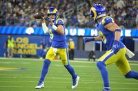 Jan 17, 2022; Inglewood, California, USA; Los Angeles Rams quarterback Matthew Stafford (9) throws a pass to wide receiver Cooper Kupp (10) during the second half of an NFC Wild Card playoff football game at SoFi Stadium. The Rams defeated the Cardinals 34-11. Mandatory Credit: Kirby Lee-USA TODAY Sports
