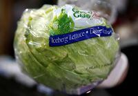 FILE PHOTO: An Iceberg lettuce is removed from a box at a vegetable market, in London, Britain February 3, 2017. REUTERS/Peter Nicholls/File Photo