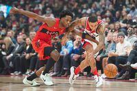 Toronto Raptors forward OG Anunoby (3) and Washington Wizards forward Kyle Kuzma (33) battle for a loose ball during first half NBA action in Toronto Wednesday, October 20, 2021. THE CANADIAN PRESS/Evan Buhler