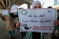 Iraqi women's rights activists lift placards during a rally near the Supreme Judicial Council in Baghdad on February 5, 2023, to protest the killing of Iraqi youtuber Tiba al-Ali by her father in Diwaniyah. - Al-Ali's death on January 31, has sparked outrage in Iraq, where so-called "honour killings" continue to take place in the conservative country. (Photo by AHMAD AL-RUBAYE / AFP) (Photo by AHMAD AL-RUBAYE/AFP via Getty Images)